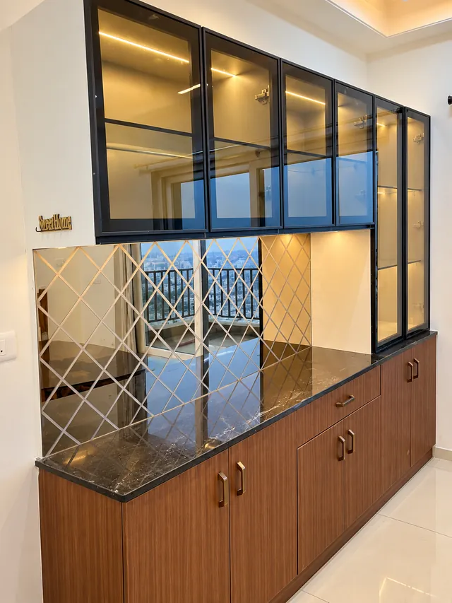 Crockery unit with glass cabinets and diamond mirror, completed by Casa Interiors in Hyderabad