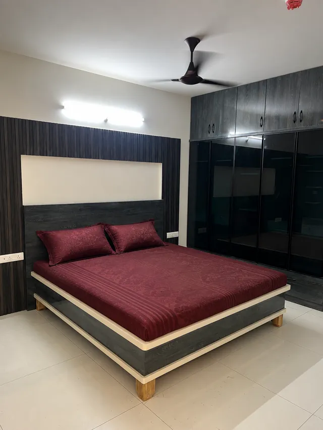 Master bedroom with fluted panel and glass wardrobe, completed by Casa Interiors in Hyderabad